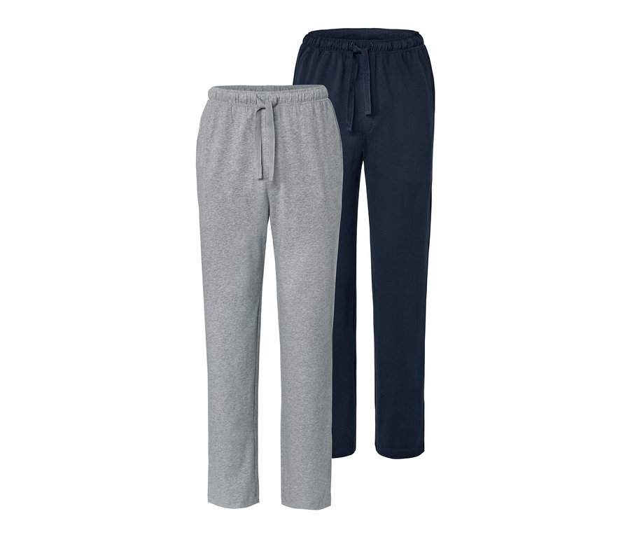 Zwei Pyjamahosen: eine graue und eine dunkelblaue.