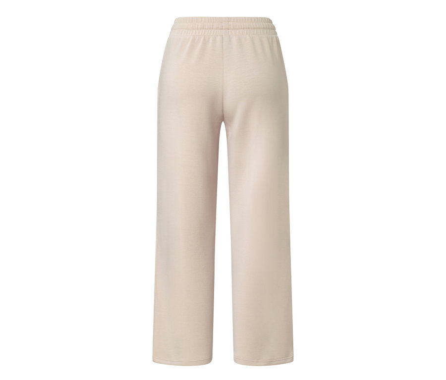 Beige Premium-Yogahose von hinten gezeigt.