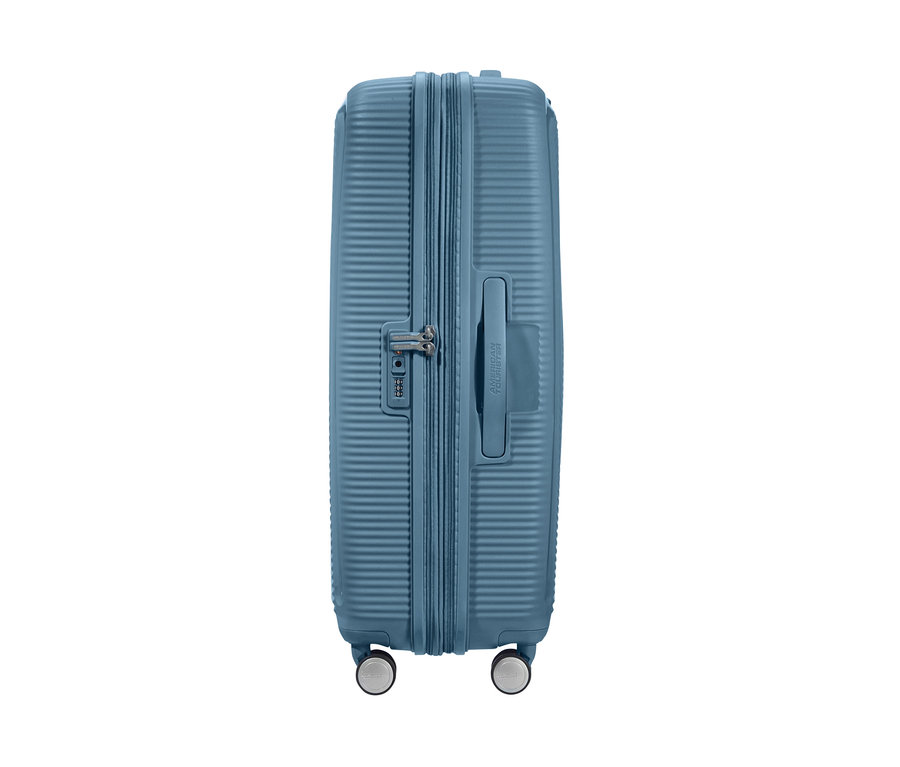 Detailansicht eines blauen American Tourister Hartschalen-Koffers »Soundbox« Spinner, groß.