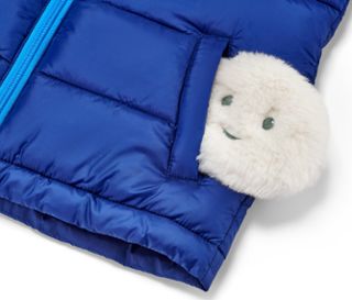 Blaue Weste mit 2 Taschenheizkissen.