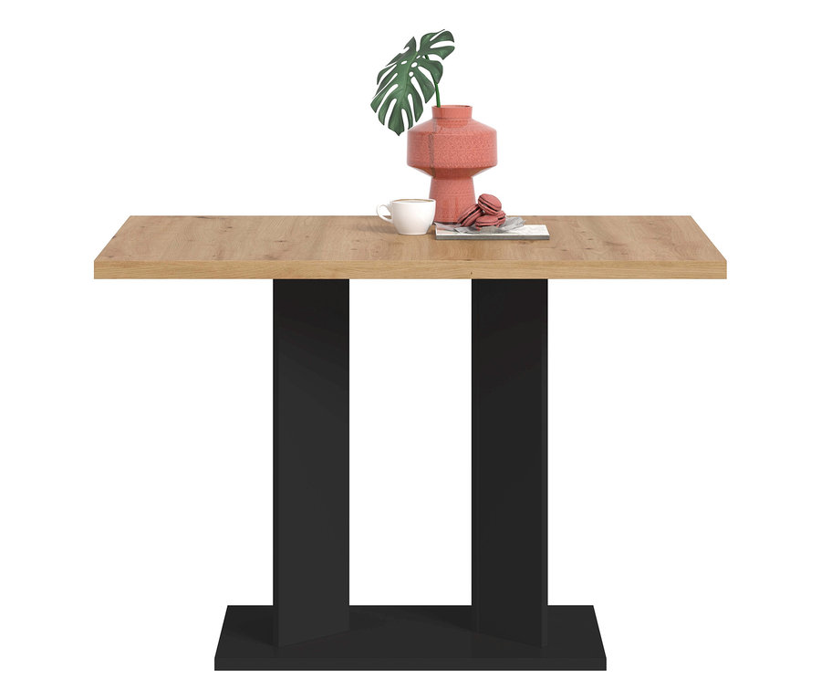 xonox Esstisch »Victor« mit heller Holzplatte und zwei schwarzen U-förmigen Sockeln. Darauf stehen eine rosa Vase mit Monstera-Blatt, eine weiße Tasse und rosa Macarons.