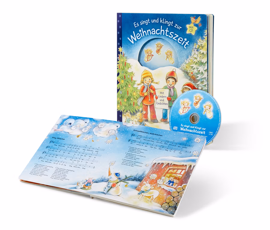 Ein offenes Buch und eine CD mit dem Titel "Es singt und klingt zur Weihnachtszeit".