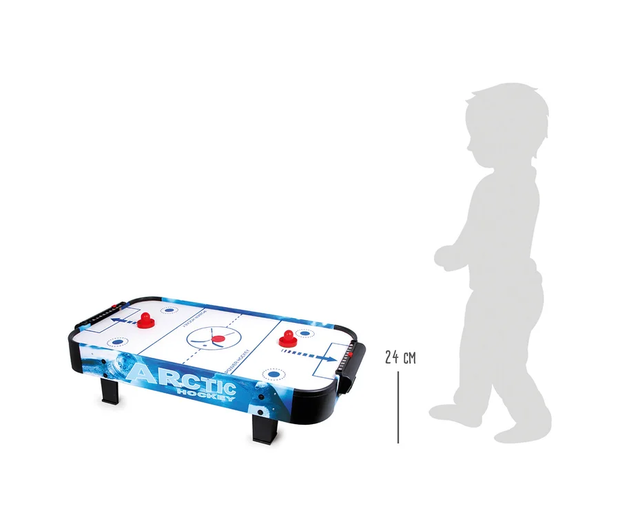 Ein small foot Air-Hockey, groß Tisch mit zwei roten Schlägern auf der weißen und blauen Spielfläche, daneben eine graue Kindersilhouette zur Größenangabe von 24 cm.
