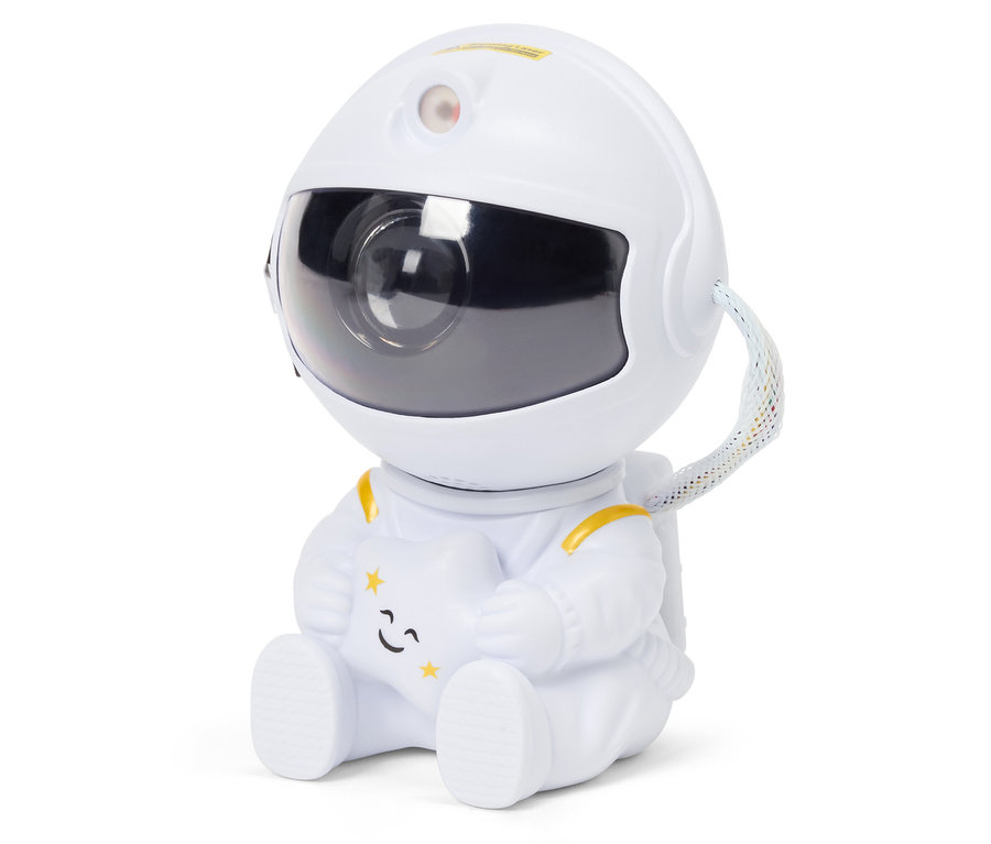 Astronaut in weißem Anzug sitzt und hält einen Stern.