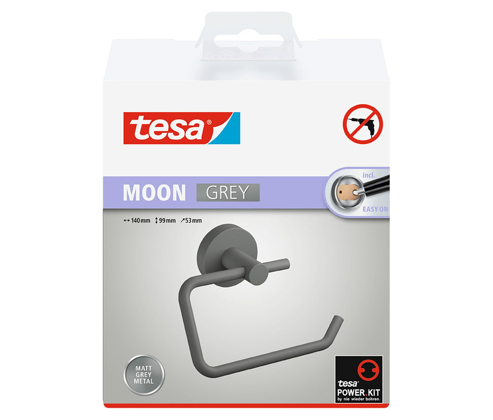 Weiße Verpackung des tesa® MOON Toilettenpapierhalters, der als mattgrauer Metallhalter auf der Vorderseite zu sehen ist.
