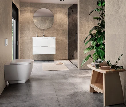 Modernes Badezimmer mit einem weißen Waschtisch »Celano« inkl. Becken, 81 cm, rundem Spiegel, Wand-WC und großer Pflanze.