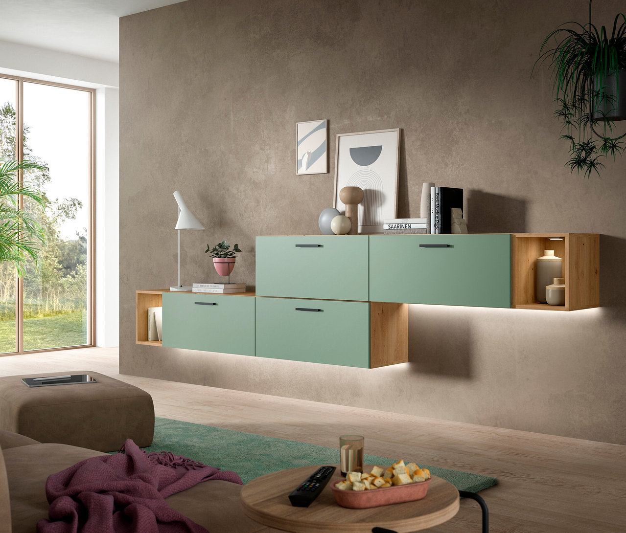 Eine moderne xonox Wohnkombination „Only“ in Grün mit integrierter Beleuchtung an einer braunen Wand, umgeben von einem Sofa, einem Couchtisch und einem Fenster.