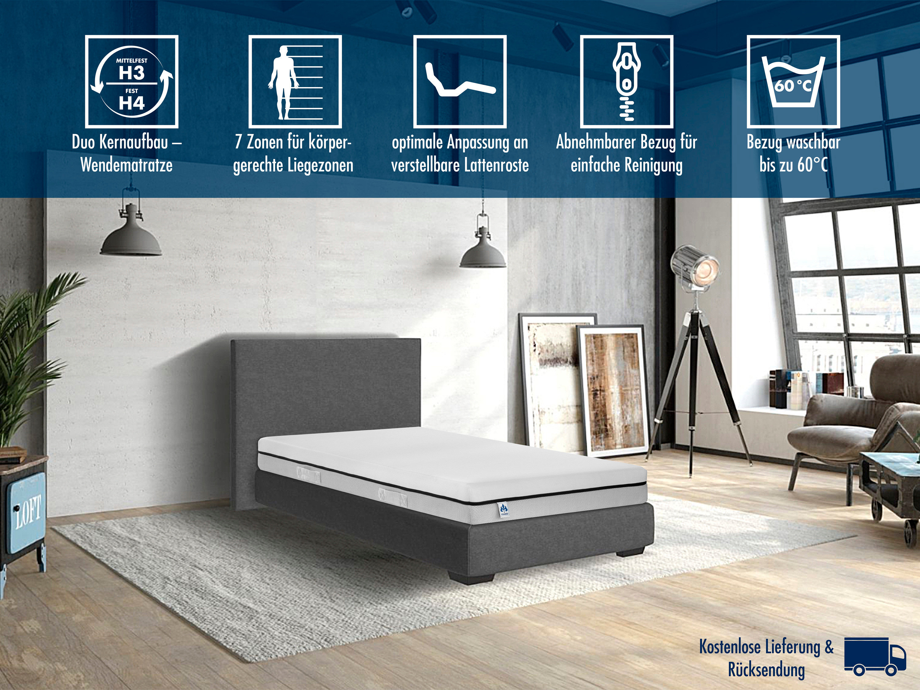 Graues Bett mit Irisette Wendematratze Hybridschaum Smart (verschiedene Größen) auf beigem Teppich in einem Raum.