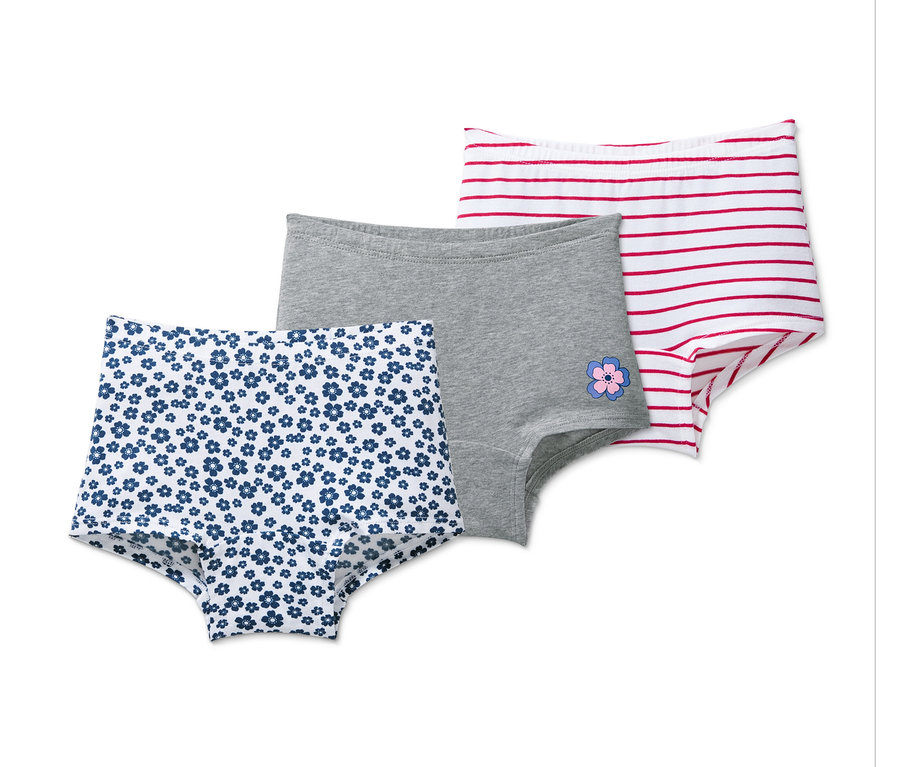 Drei Pantys: eine mit blauen Blumen, eine graue mit Blume, eine weisse mit roten Streifen.