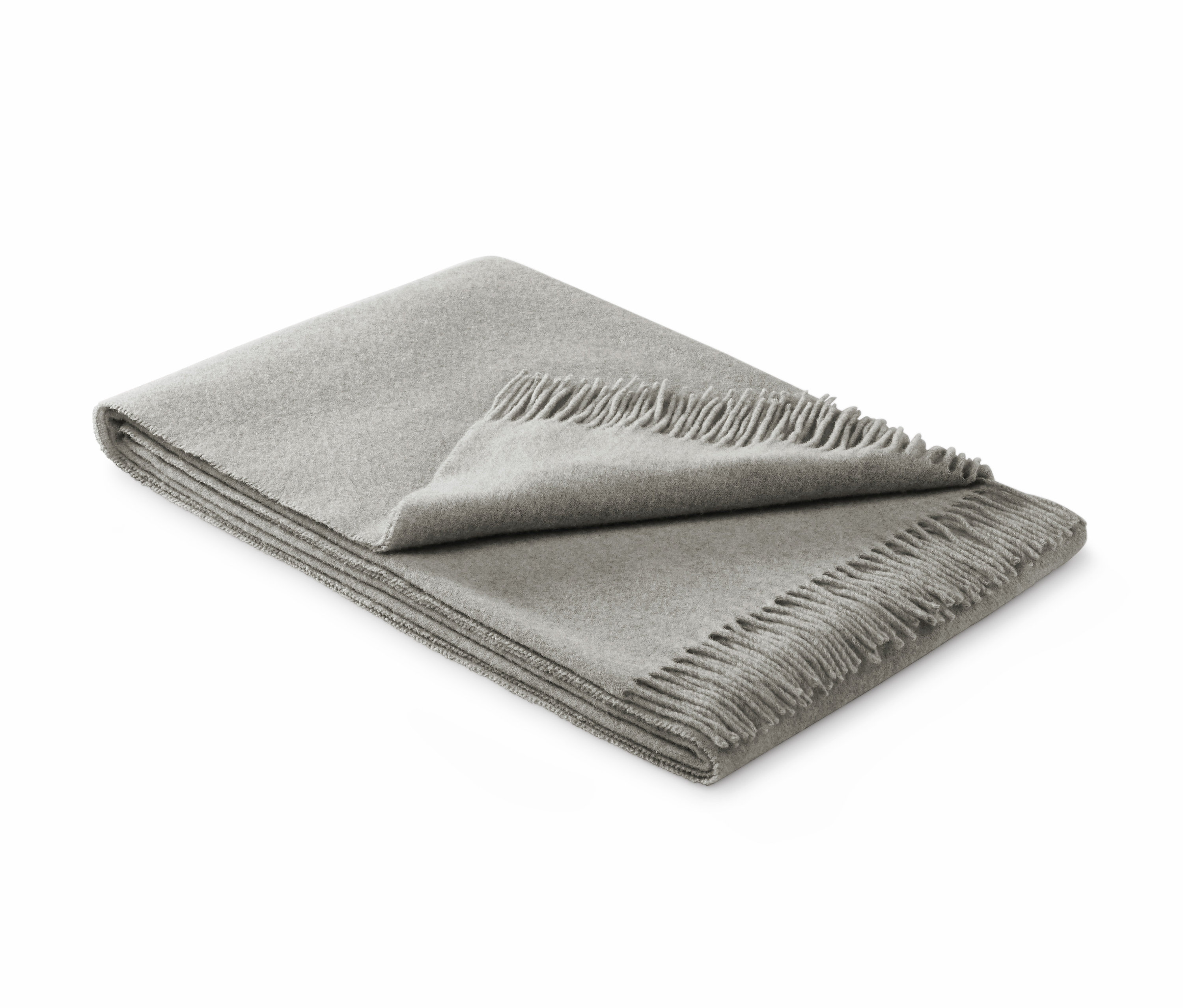 Ein gefalteter Wollplaid mit Fransen.