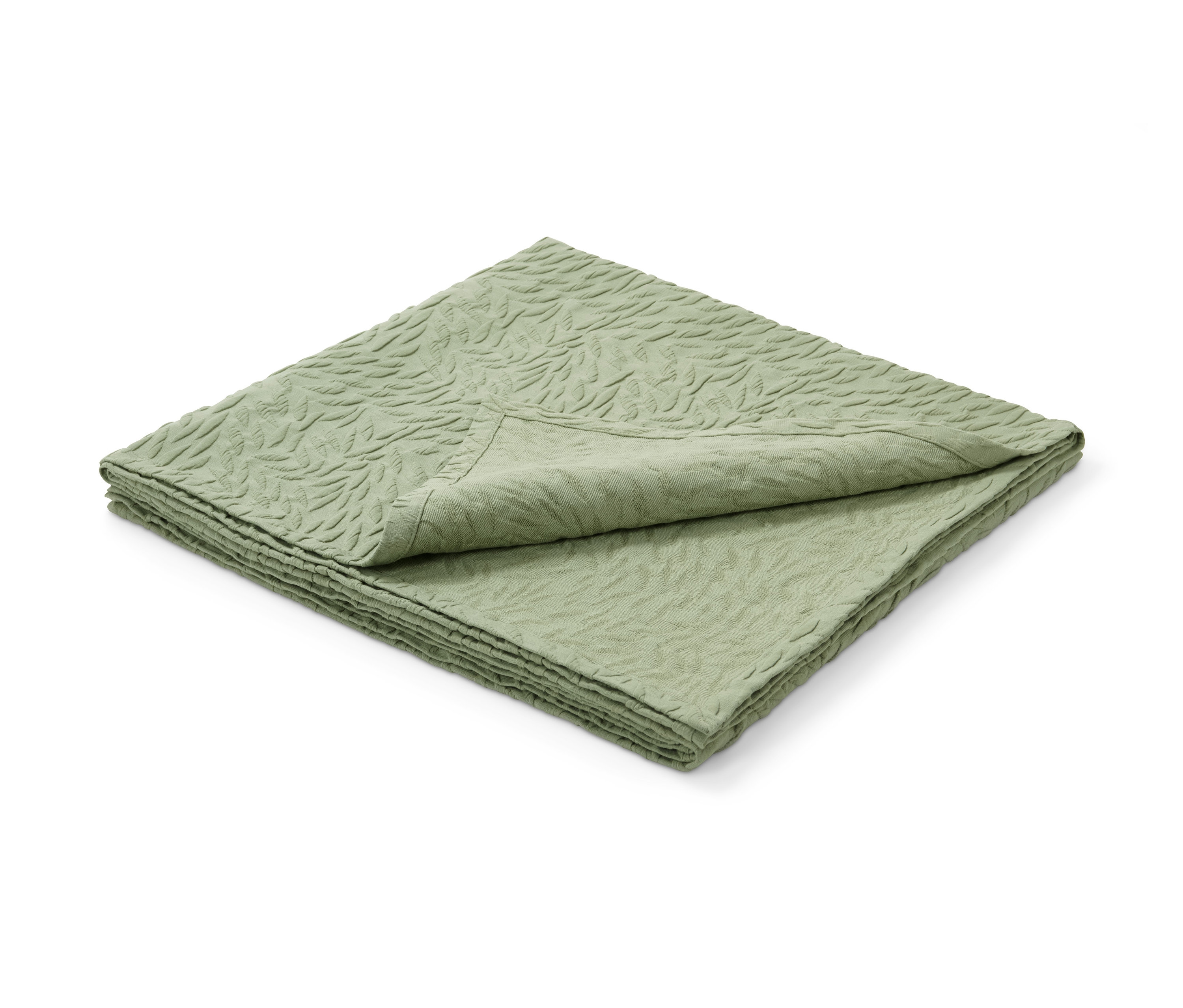 Ein grüner Premium-Bettüberwurf mit Reliefmuster liegt gefaltet.