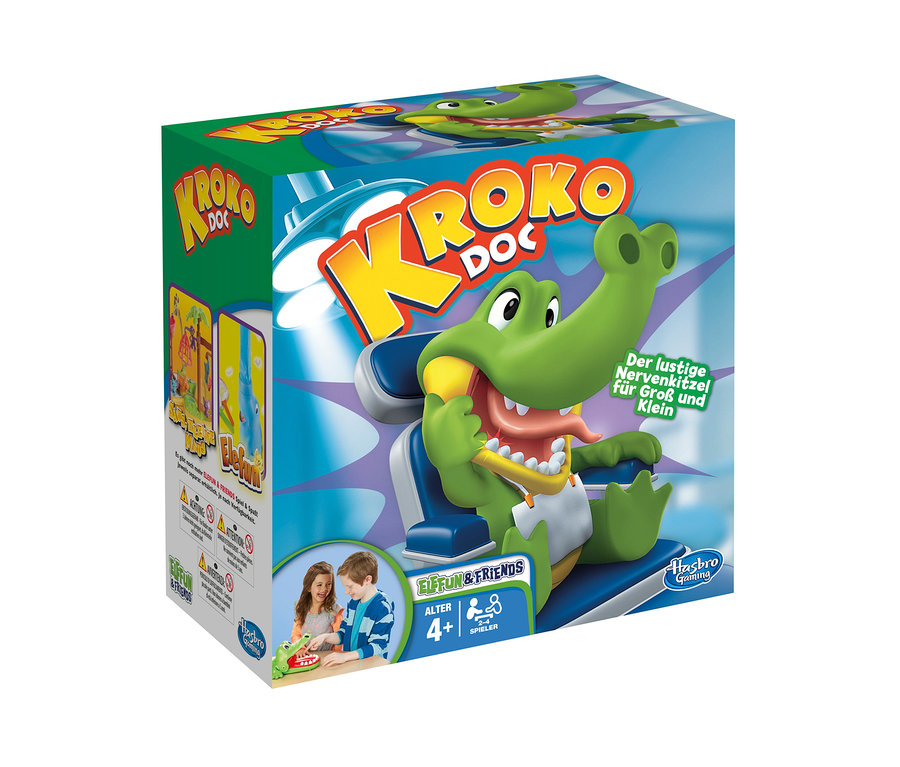 Verpackung von Hasbro "Kroko Doc" mit einem Cartoon-Krokodil, das in einem Zahnarztstuhl sitzt.