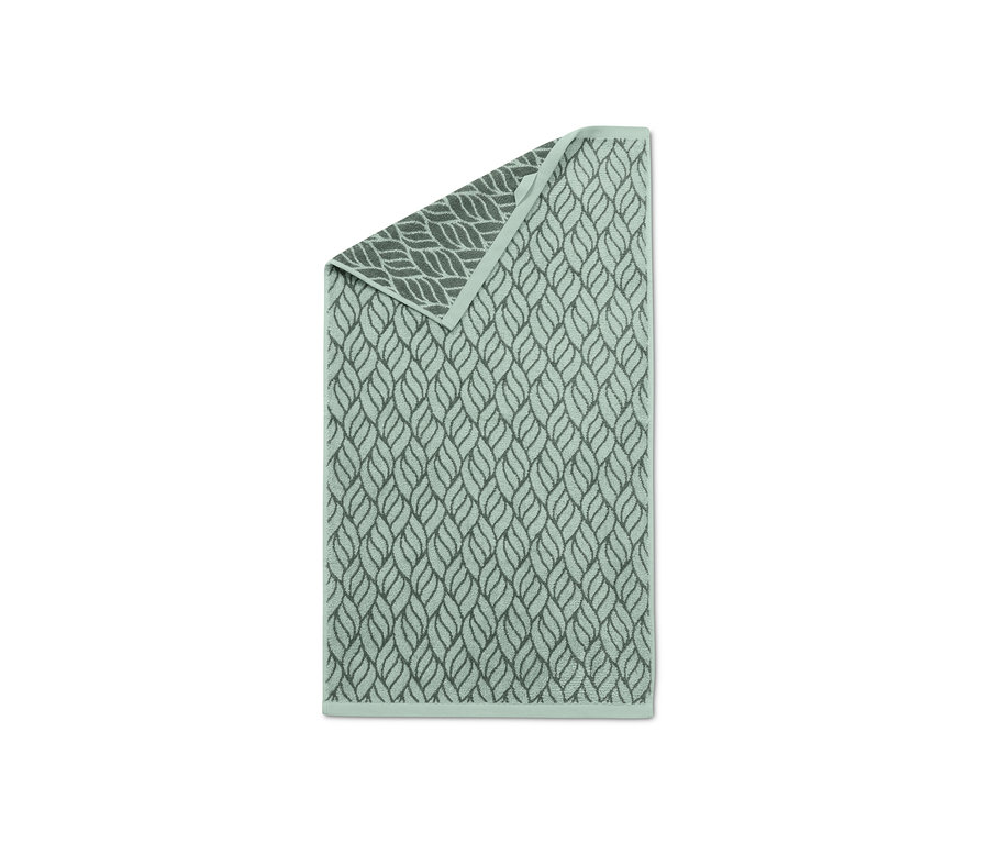 Zwei mintgrüne Jacquard-Handtücher mit Blattmuster.