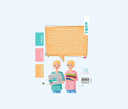 Zwei Comicfrauen mit blonden Haaren halten eine Nähmaschine und einen Stoffstapel. Im Hintergrund das Buch "Näh doch einfach".