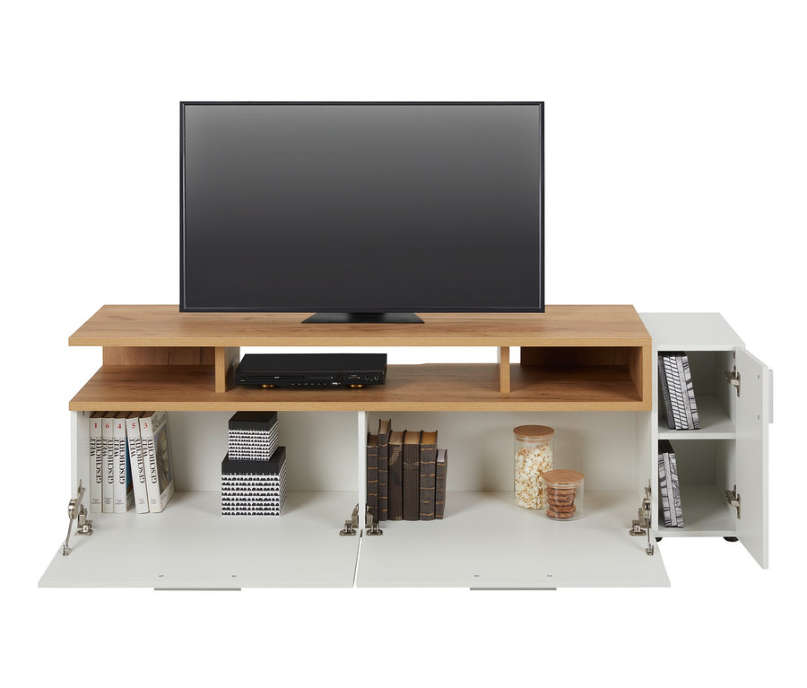 Fernseher steht auf braun-weißem Lowboard "Nonza". In den unteren Regalen stehen Bücher, DVD-Player und Vorratsdosen.