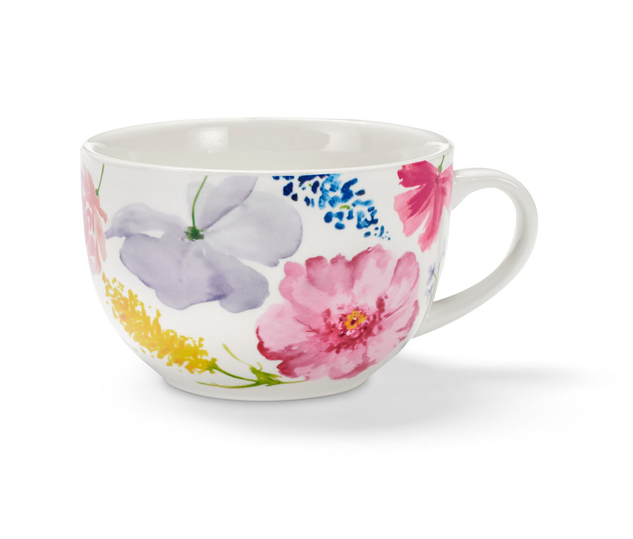 Weisse Milchkaffeeschale mit Blumenmuster.