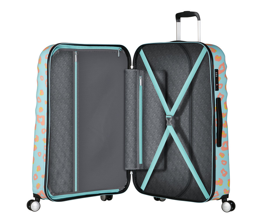 Geöffneter American Tourister Wavebreaker »Minnie Mouse«, groß, mit blauem Aufdruck und orangefarbenen Flecken.