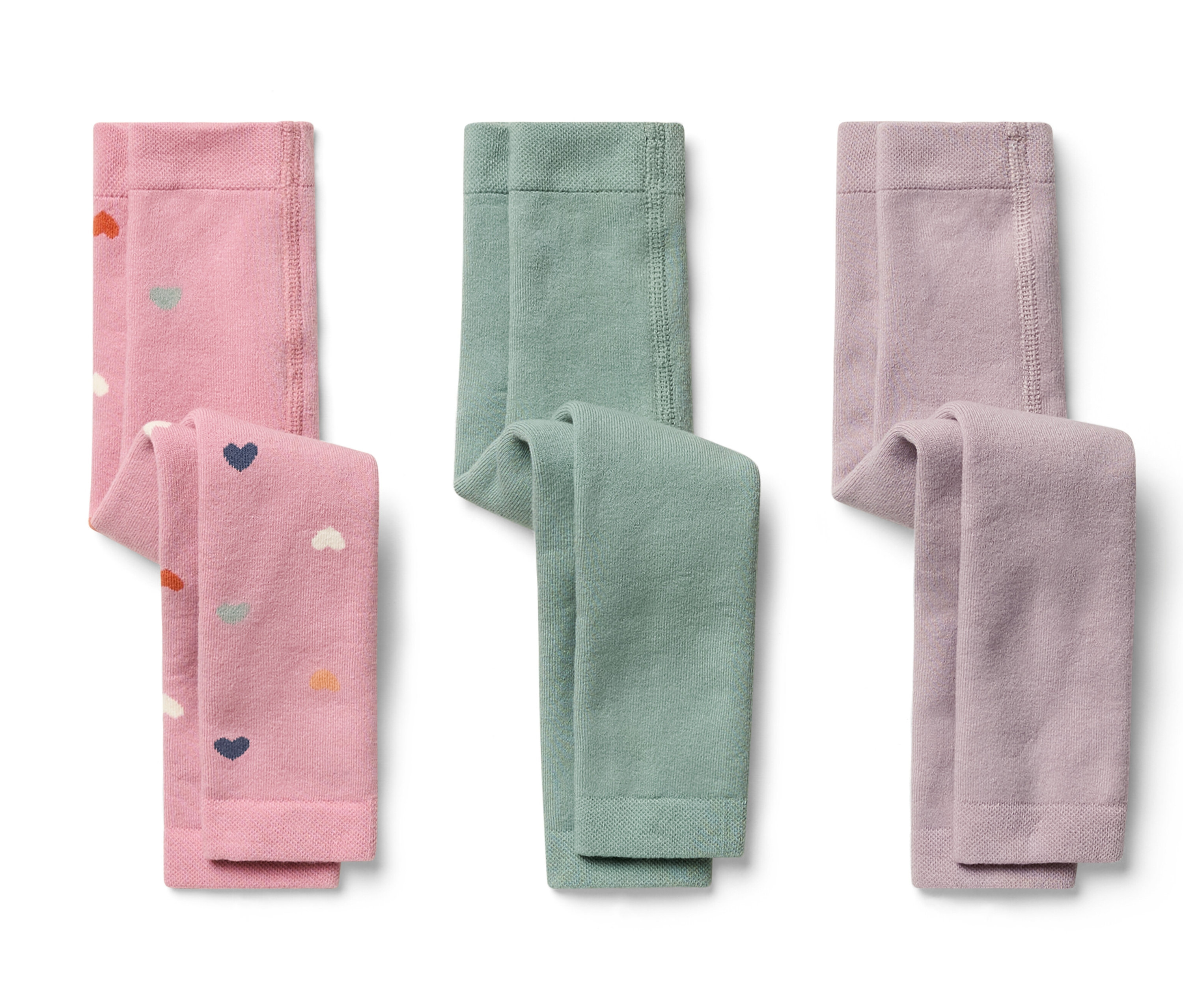 Drei Kinderleggings: rosa mit Herz- und Wolkenmuster, grün und helllila.