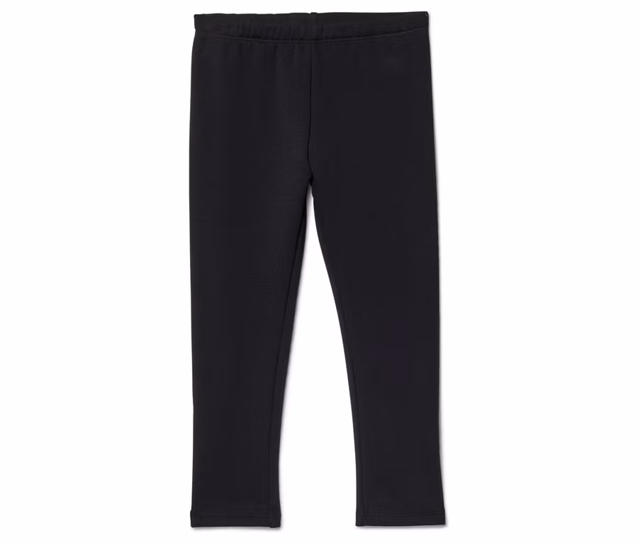 Schwarze Leggings mit elastischem Bund liegen auf einem weißen Hintergrund.