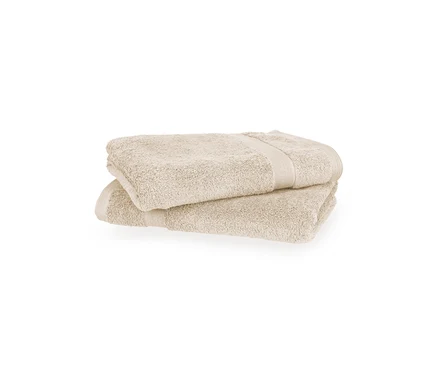 Zwei sandfarbene Badetücher der SCHÖNER WOHNEN-Kollektion "Cuddly" liegen gefaltet übereinander.