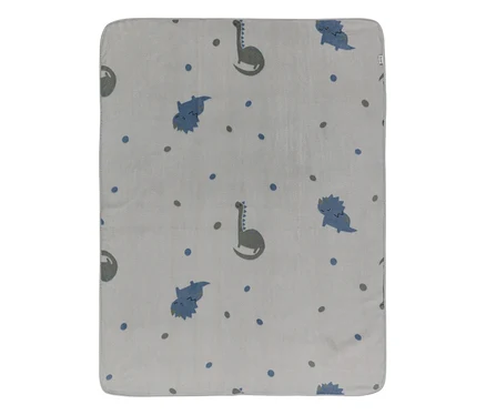 Hellgraue Decke mit einem Muster aus blauen und grauen Dinosauriern sowie verstreuten blauen und grauen Punkten.