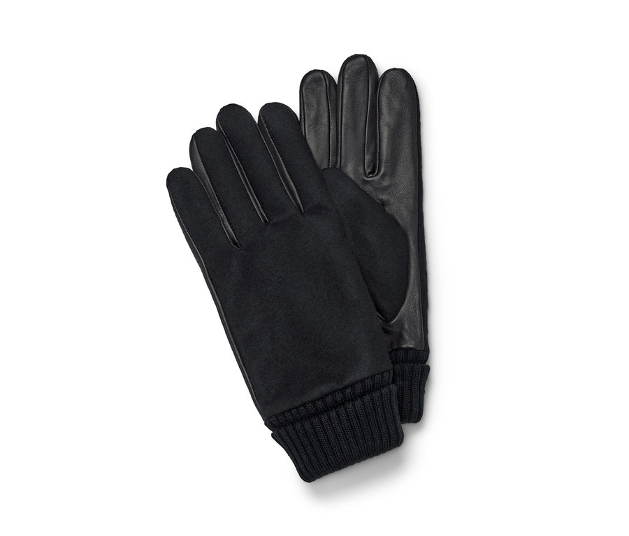 Zwei schwarze Lederhandschuhe liegen auf einem weißen Hintergrund.