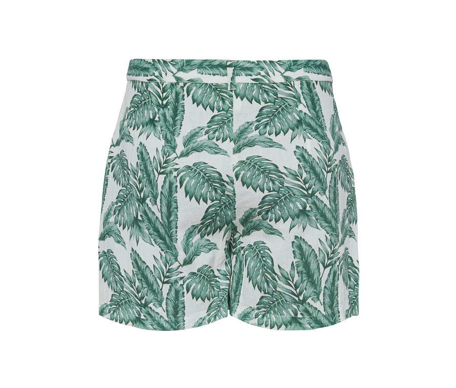 Weiße Shorts mit grünem Blattmuster.