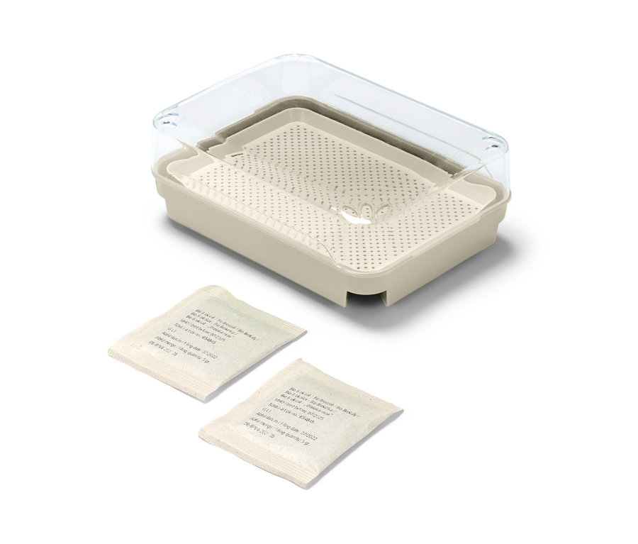 Microgreens-Anzuchtset mit transparentem Deckel und zwei Samentüten.