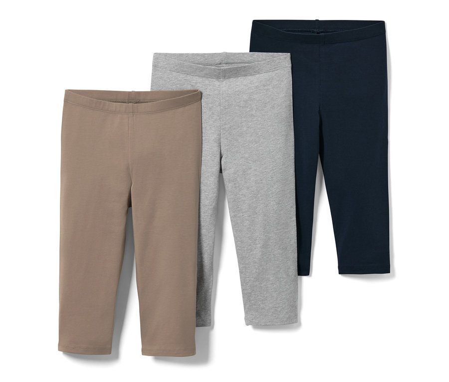 Drei Kinder-3/4-Leggings in Braun, Grau und Dunkelblau.