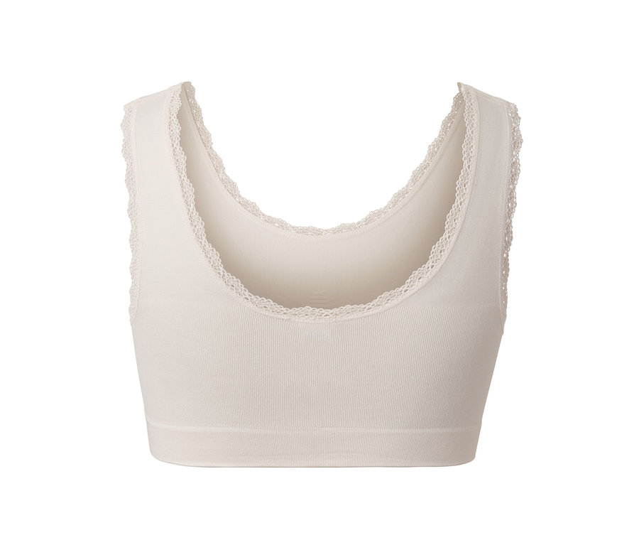 Ein cremefarbenes Seamless-Bustier mit Spitzenrand.