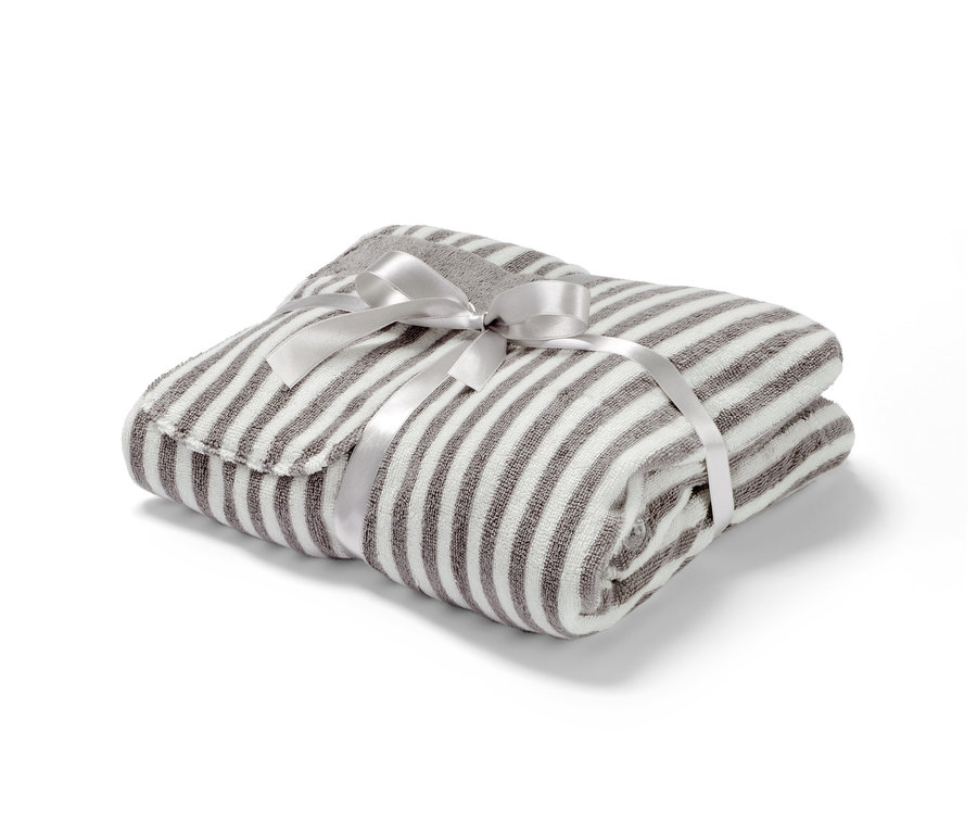 Zusammengelegter Premium-Damen-Saunakilt, gestreift, mit silberner Schleife.