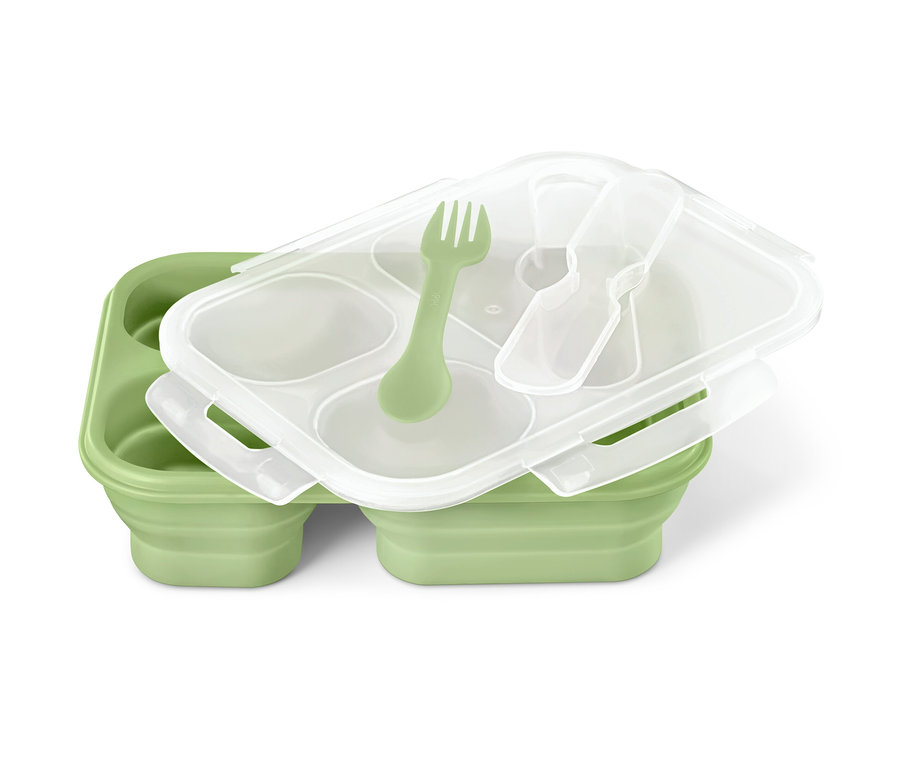 Eine grüne, faltbare Lunchbox mit transparentem Deckel, einer grünen Gabel und einem transparenten Löffel.