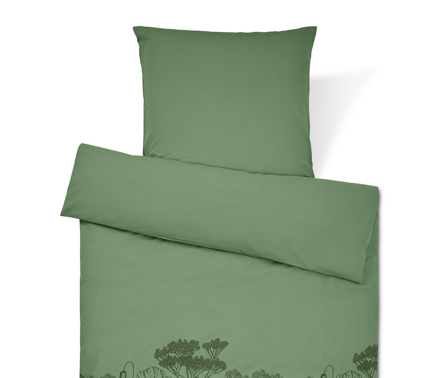 Grüne Bettwäsche mit Blumenmuster.