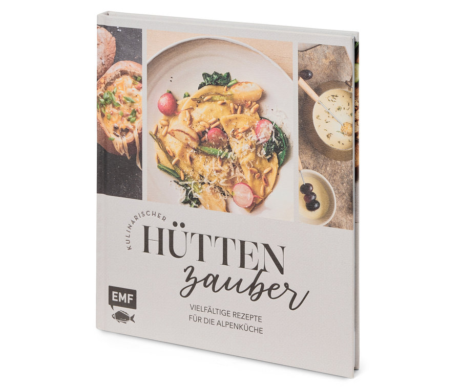 Nahaufnahme eines Kochbuchs namens Hüttenzauber mit Essensbildern.