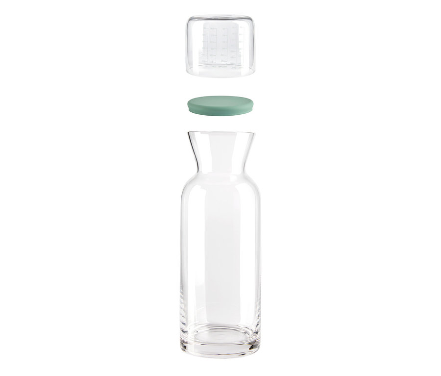 Eine zerlegte Glas-Portionierdose mit Messbecher und Deckel.