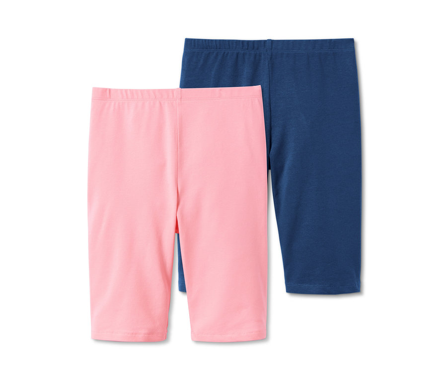 Zwei Radler-Leggings aus Bio-Baumwolle: eine rosa, eine blau.