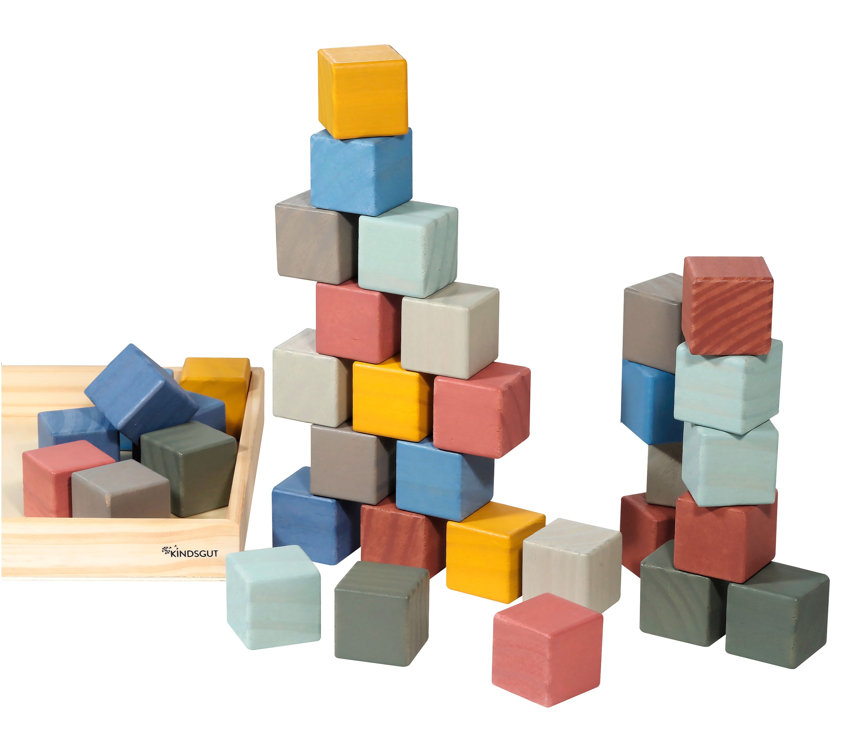 Bunte Bauklötze sind gestapelt und liegen in einem Holztablett.