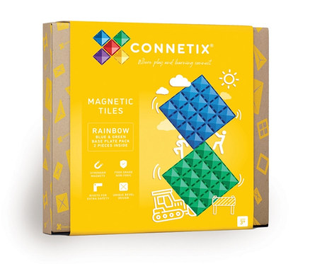 Gelb-braune Schachtel Connetix Magnetspielzeug Basisplatten, Regenbogen, mit blauen und grünen Magnetfliesen.