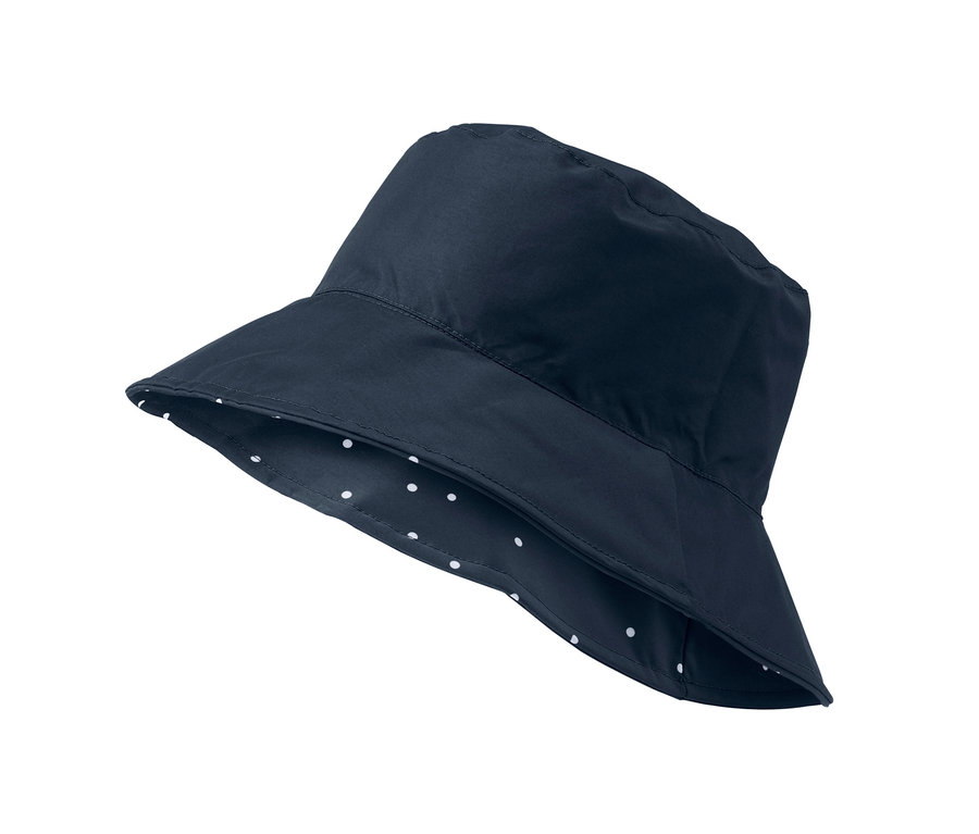 Marineblauer Wende-Regenhut mit weißen Punkten auf der Innenseite.