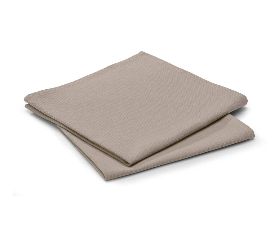 Zwei beige Leinenmischservietten liegen gefaltet übereinander.