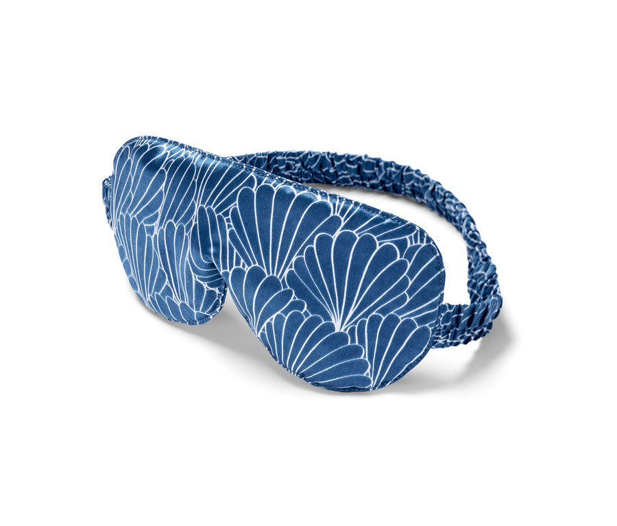 Blaue Seiden-Schlafmaske mit weißem Muster.