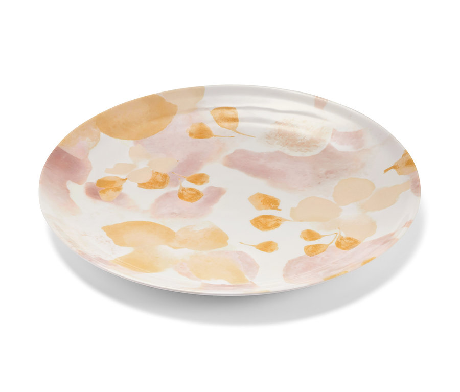 Ein ovaler Servierteller mit Blumenmuster in Pfirsich- und Rosatönen.