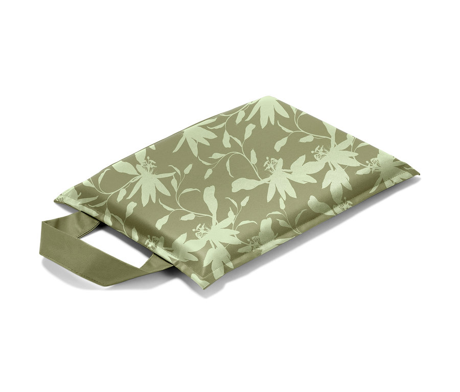 Kniekissen mit Blatt- und Blumenmuster.