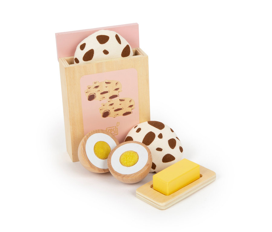 Ein Spielzeug-Set mit Holzelementen, darunter Eier, Butterwürfel und Kekse in einer Box. small foot Mixer-Set »tasty«.