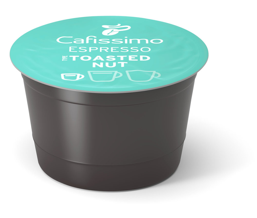 Eine Cafissimo Flavoured Espresso - Toasted Nut - Kapsel liegt auf einem weißen Untergrund.