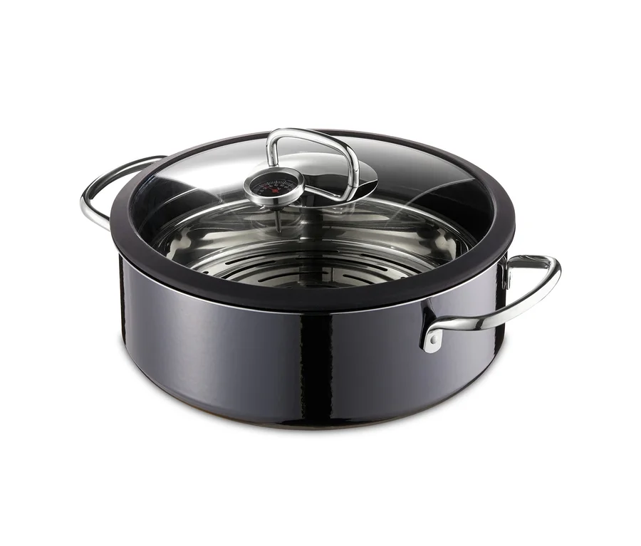 Ein schwarzer, runder Silit-Dampfgarer Ecompact Professional mit transparentem Deckel.
