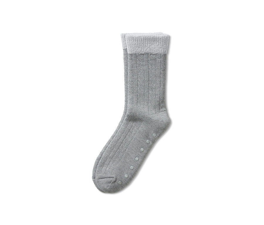 Graue Hausschuhsocken mit weißem Rand und rutschfester Sohle.