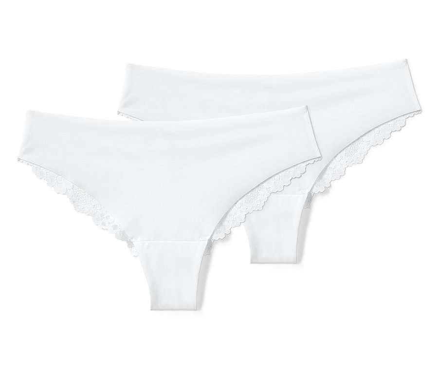 Zwei weiße Magic-Cut-Braziltangas mit Spitze liegen übereinander.