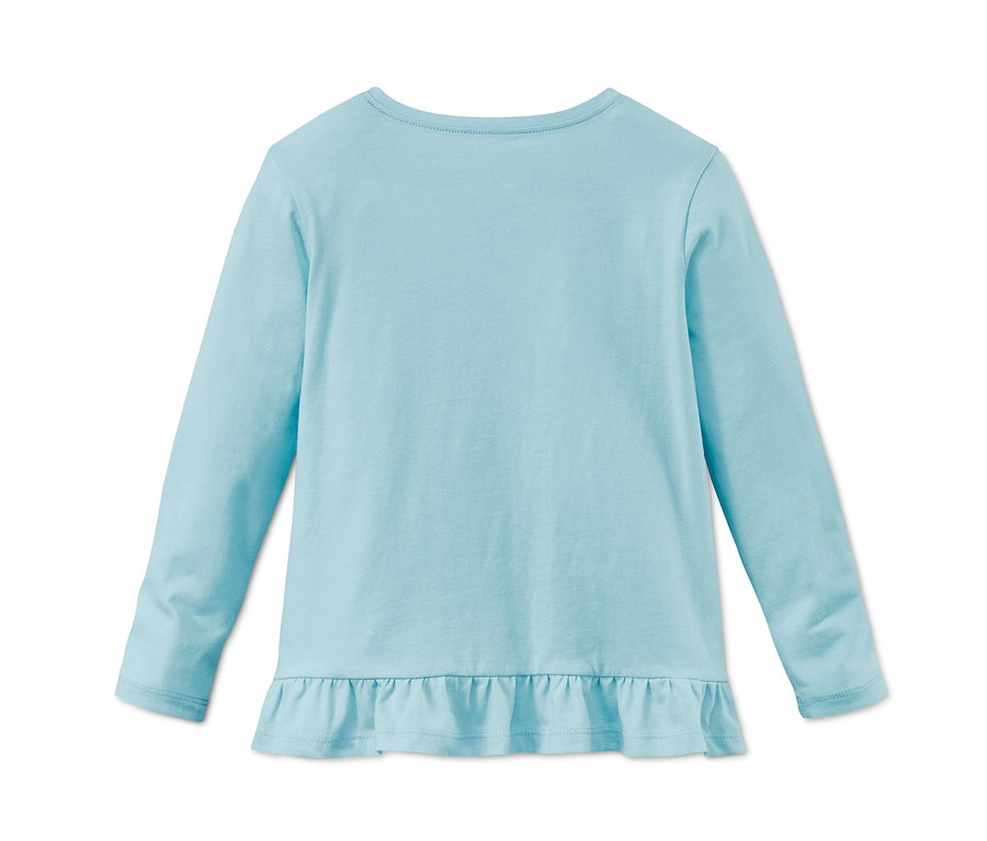 Ein blaues Langarmshirt mit Rüschensaum, aus dem 3 Shirts aus Bio-Baumwolle Set.