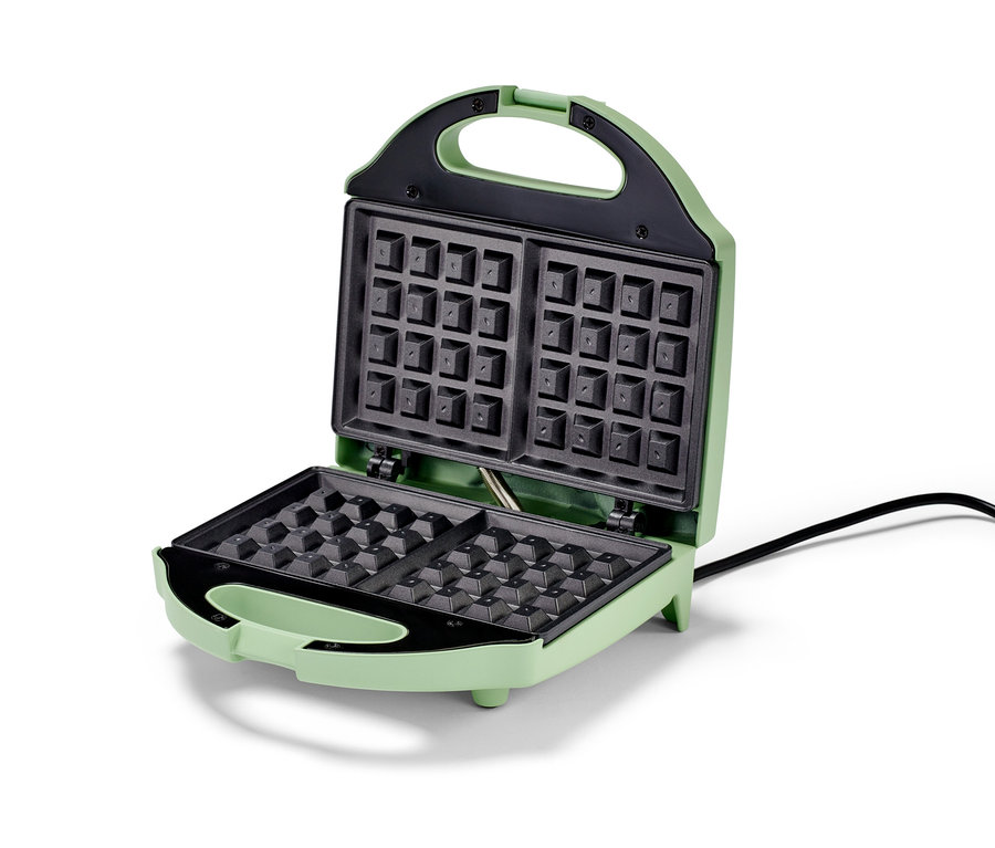 Ein geöffnetes, grünes Waffeleisen.